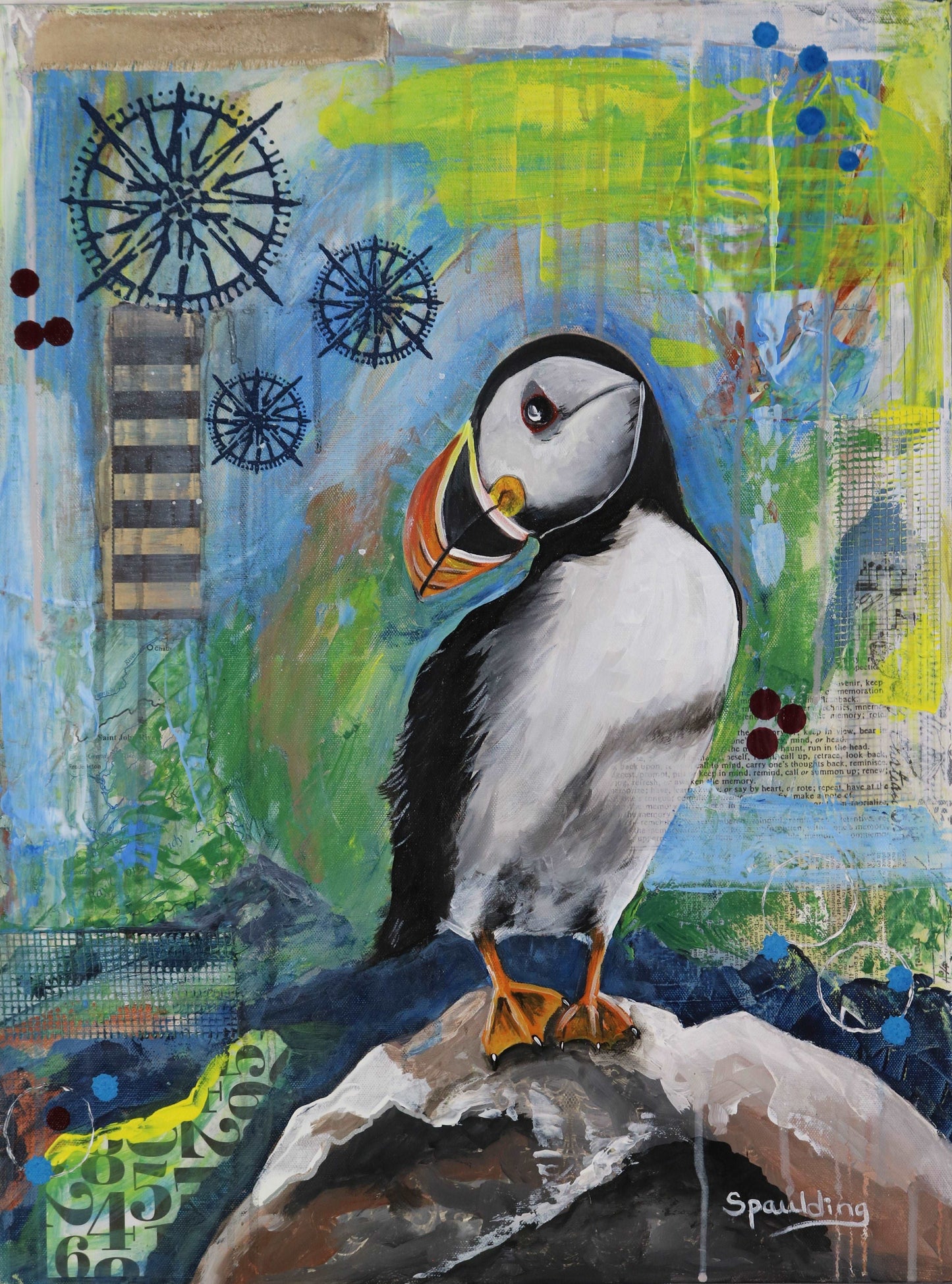 Mixed media artwork of a puffin on a rocky perch with a collage and paint background.
