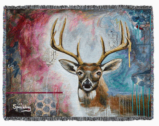 Whitetail deer face with antlers, deep reds, and blues color scheme woven throw blanket: Nature-inspired comfort for wildlife enthusiasts.