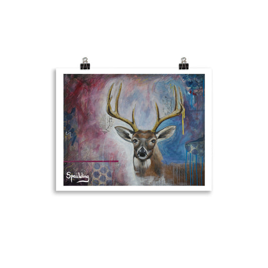 Paper art print of a whitetail deer with antlers with a background of light blues, darker blues and deep reds.