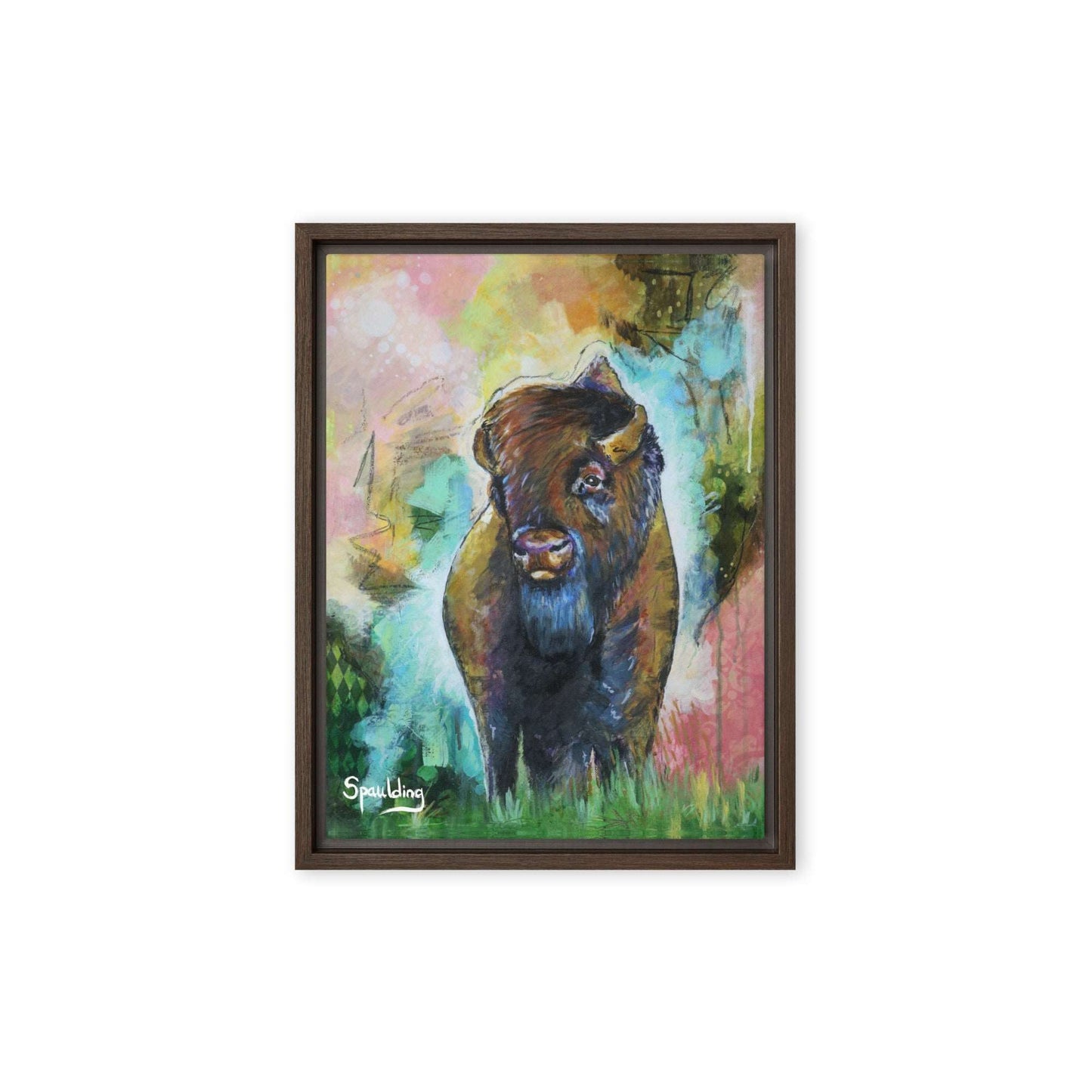 Framed canvas print with a bison standing in grass with a pink, yellow, green, teal color scheme background.