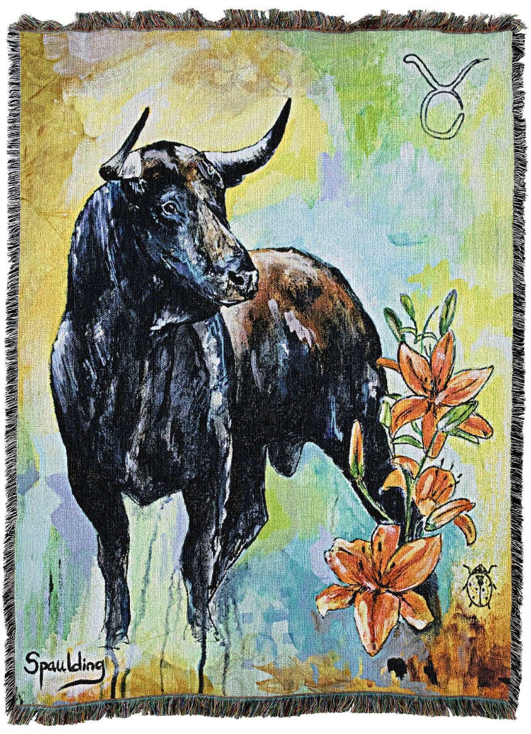A painting depicts a black bull standing beside vibrant orange lilies. The background is a blend of yellow, green, and blue hues. A Taurus zodiac symbol is in the upper right corner.