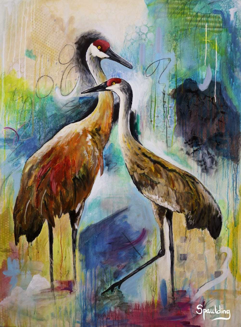 Painting of two cranes with red crowns, standing gracefully against a vibrant, abstract background of blues, greens, and yellows, conveying elegance.